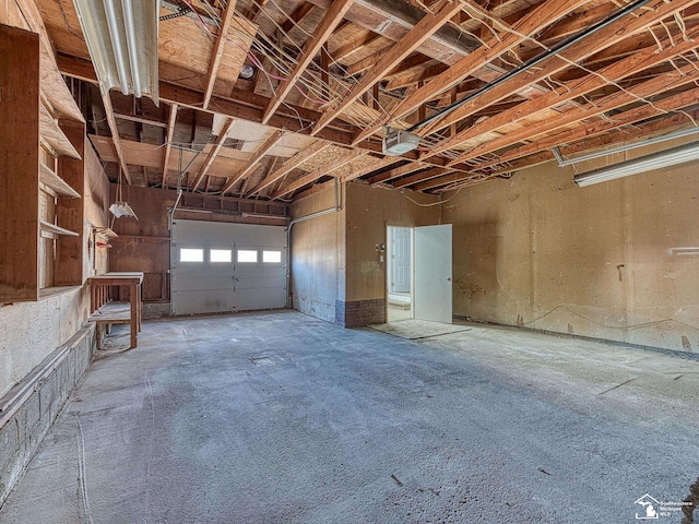 garage featuring a garage door opener