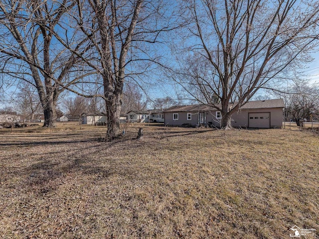 view of yard featuring a garage