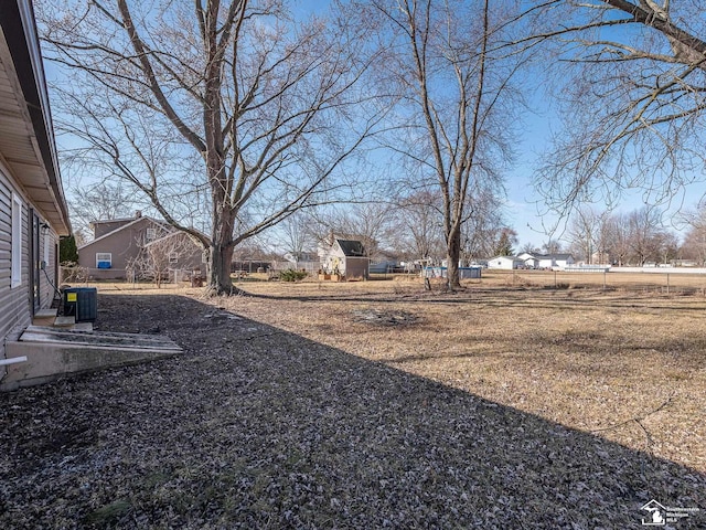 view of yard with central AC unit