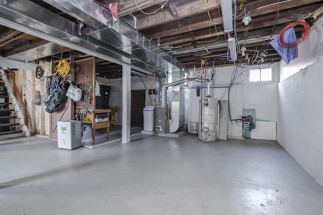 below grade area featuring gas water heater and heating unit