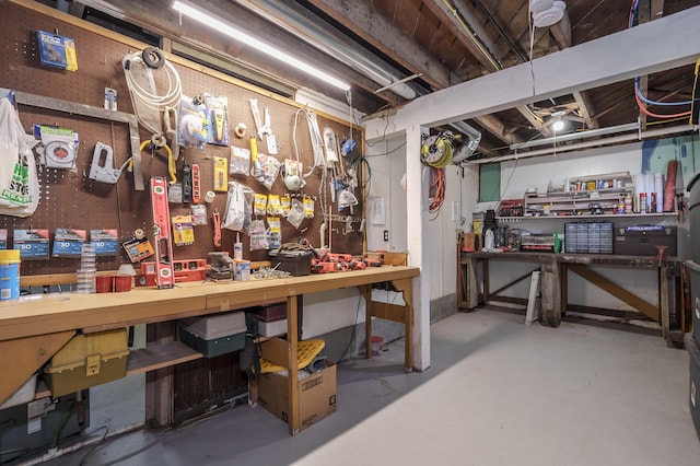 unfinished basement with a workshop area