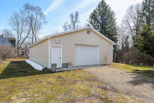 detached garage featuring driveway