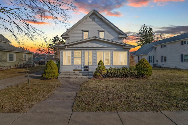 view of front of house with a lawn