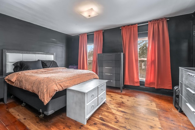 bedroom with hardwood / wood-style flooring