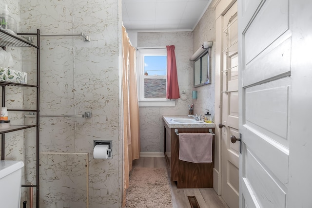 full bath with visible vents, wood finished floors, and vanity