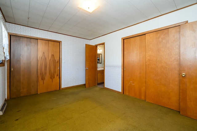 unfurnished bedroom with carpet floors, ornamental molding, and wallpapered walls