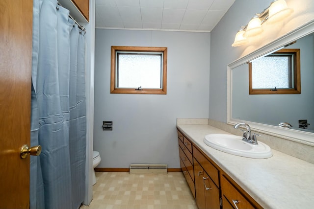 full bath featuring vanity, baseboards, a baseboard radiator, tile patterned floors, and toilet