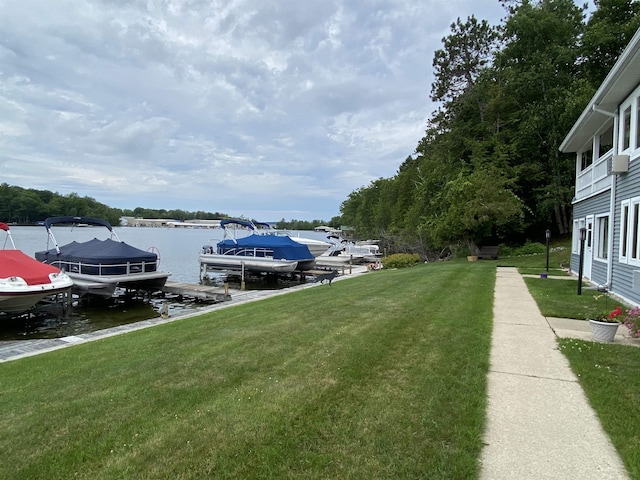 9059 Clam Lake Rd, Bellaire, MI 49615 - dock area with a yard, a water view, and boat lift