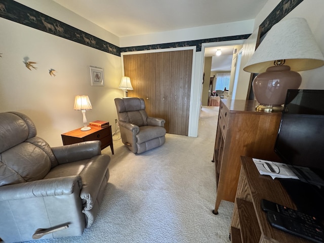 living area featuring light colored carpet