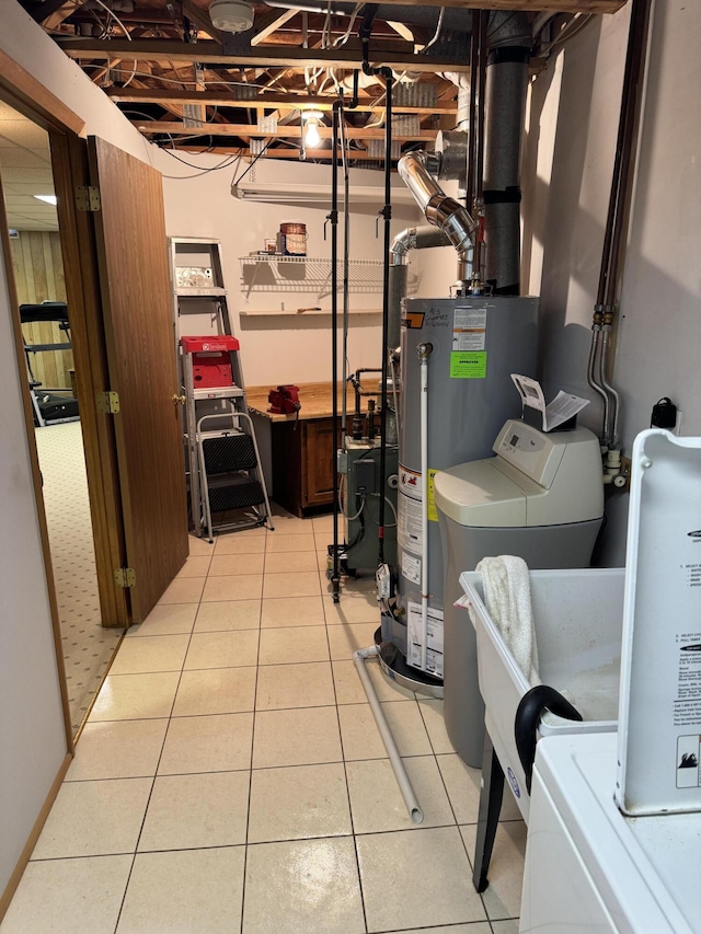 utility room featuring water heater