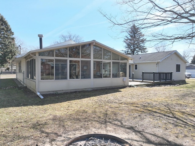 back of property featuring a sunroom