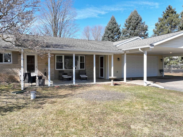 ranch-style house with a front yard, an attached garage, covered porch, a shingled roof, and a carport