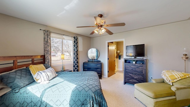 carpeted bedroom with baseboards and ceiling fan