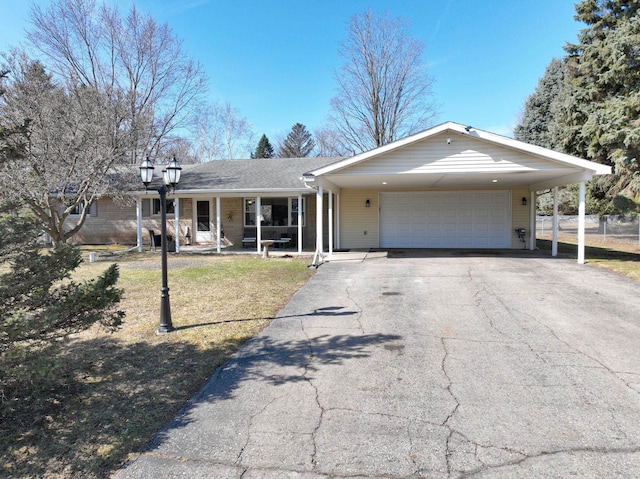 ranch-style house with aphalt driveway, a front yard, and a garage