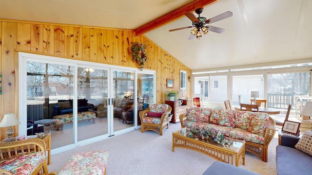 sunroom featuring a wealth of natural light, vaulted ceiling with beams, and ceiling fan