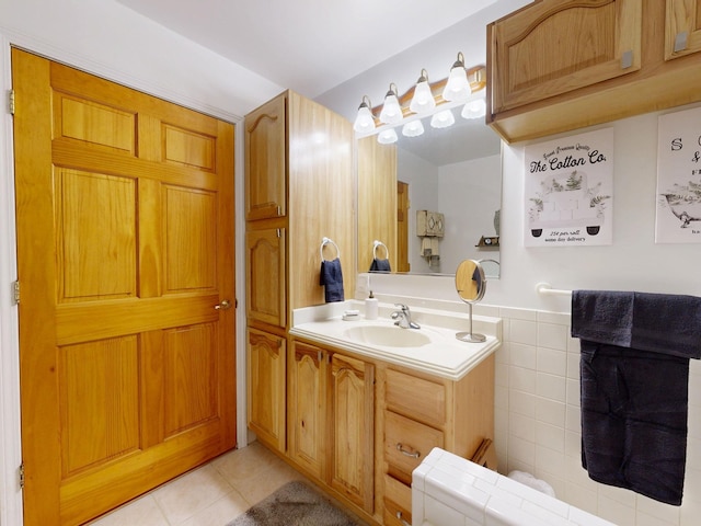 bathroom with vanity, tile patterned floors, and tile walls