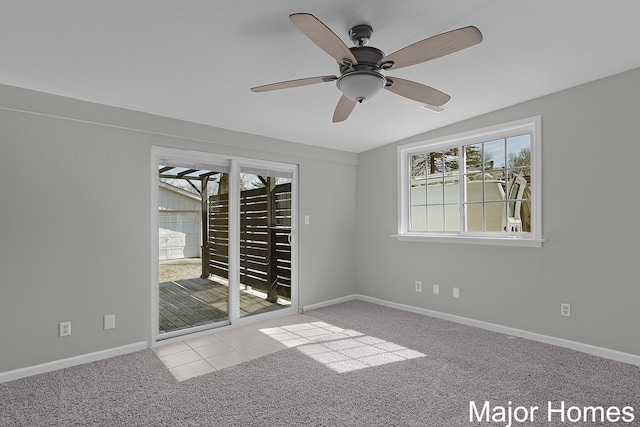 unfurnished room featuring carpet flooring, baseboards, and ceiling fan