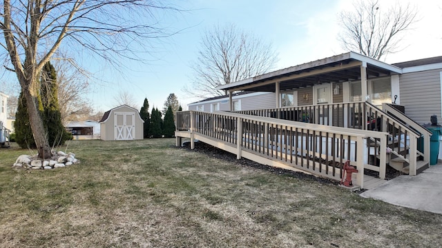 view of yard with an outbuilding and a shed