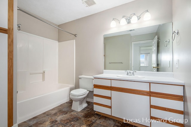 full bathroom featuring vanity, toilet, visible vents, and shower / washtub combination