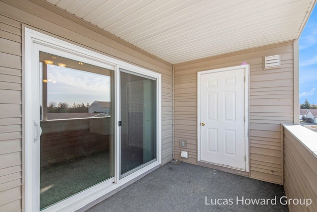 property entrance with a balcony