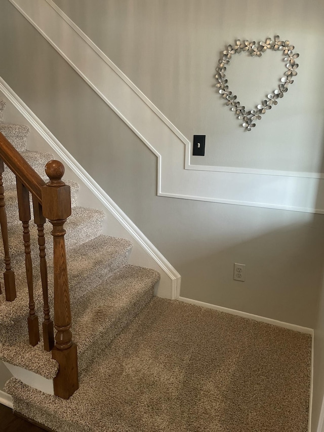 staircase with carpet floors