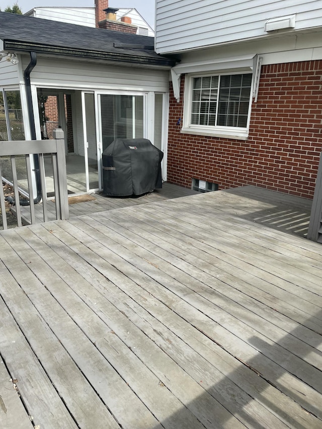 wooden terrace with grilling area