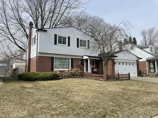 view of front of house with driveway, brick siding, an attached garage, and a front yard