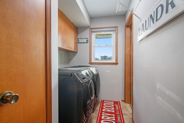 laundry area with cabinet space and washing machine and dryer