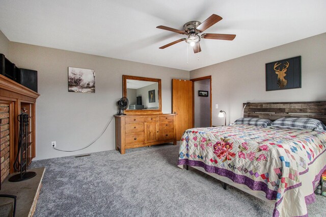 bedroom featuring carpet flooring, ceiling fan, and visible vents