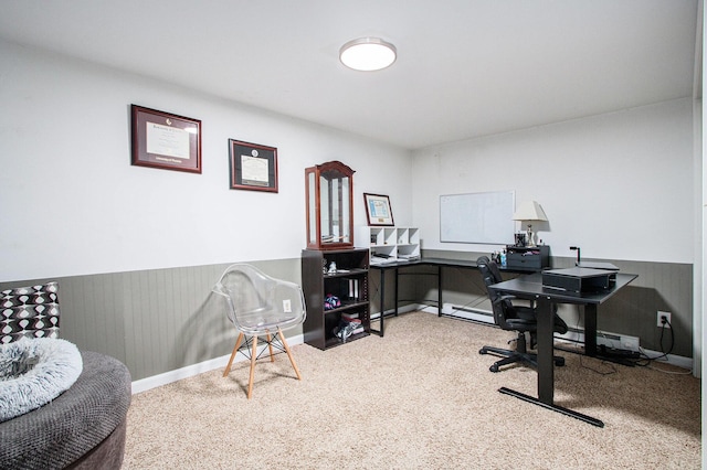 carpeted office space with a wainscoted wall
