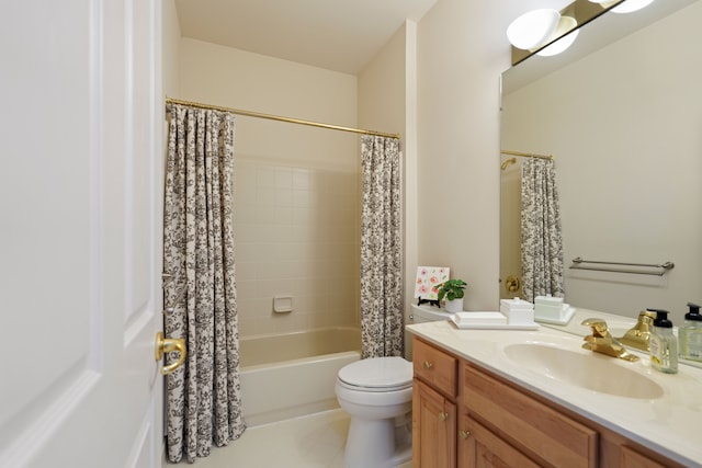 full bathroom featuring tile patterned flooring, toilet, vanity, and shower / tub combo