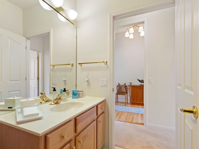 bathroom with baseboards and vanity