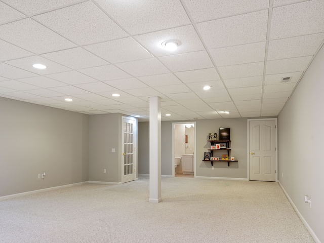 finished below grade area with recessed lighting, visible vents, baseboards, and light colored carpet