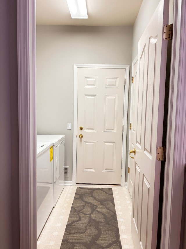 laundry area featuring laundry area and separate washer and dryer