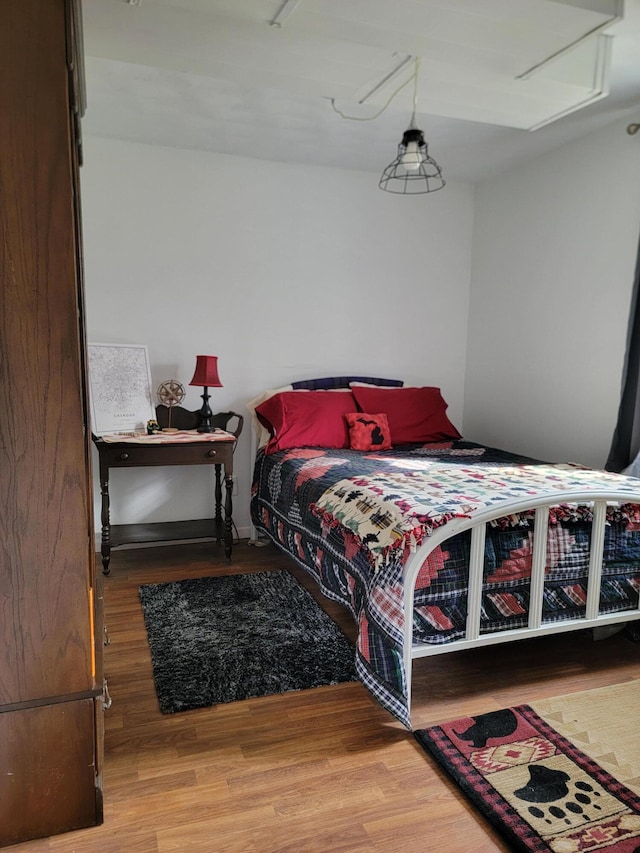 bedroom featuring wood finished floors