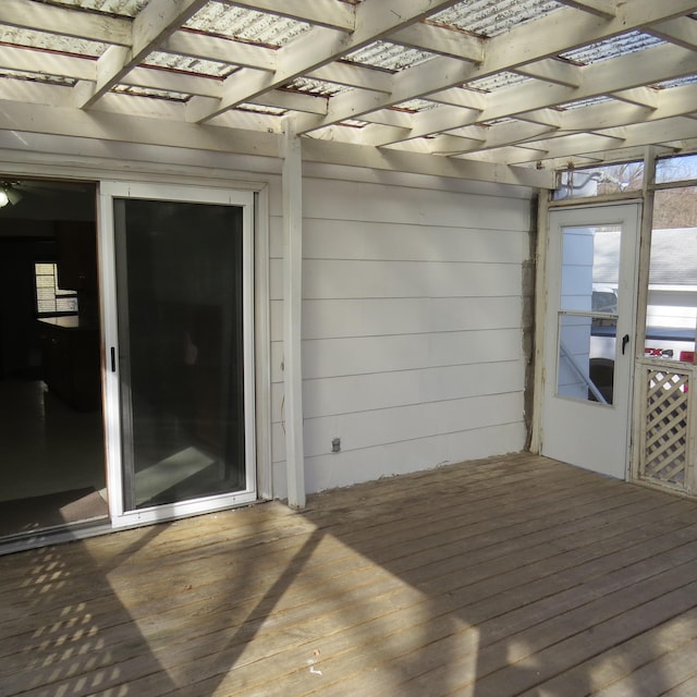 wooden deck featuring a pergola