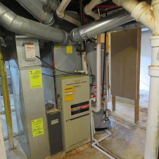 utility room featuring gas water heater