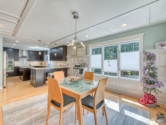 dining room featuring recessed lighting, visible vents, and light wood finished floors