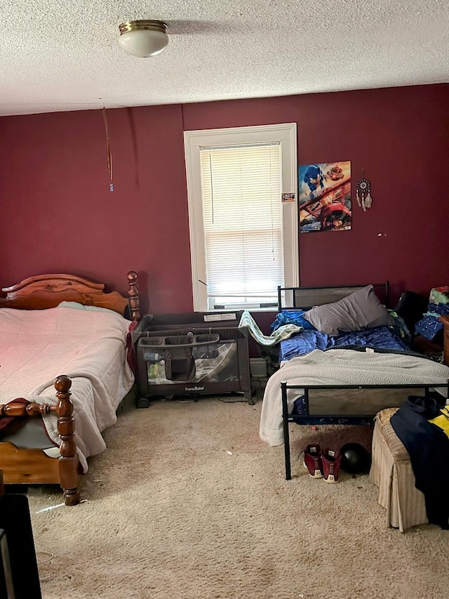 carpeted bedroom with a textured ceiling