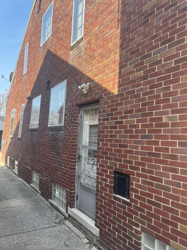 view of home's exterior featuring brick siding