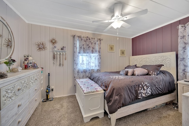 carpeted bedroom with a ceiling fan and ornamental molding