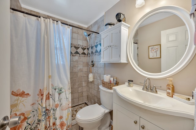 full bath with toilet, vanity, and a tile shower