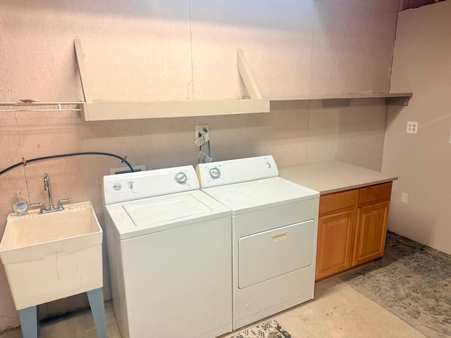 9545 Mcgregor Rd, Pinckney, MI 48169 - laundry area with cabinet space and washing machine and clothes dryer