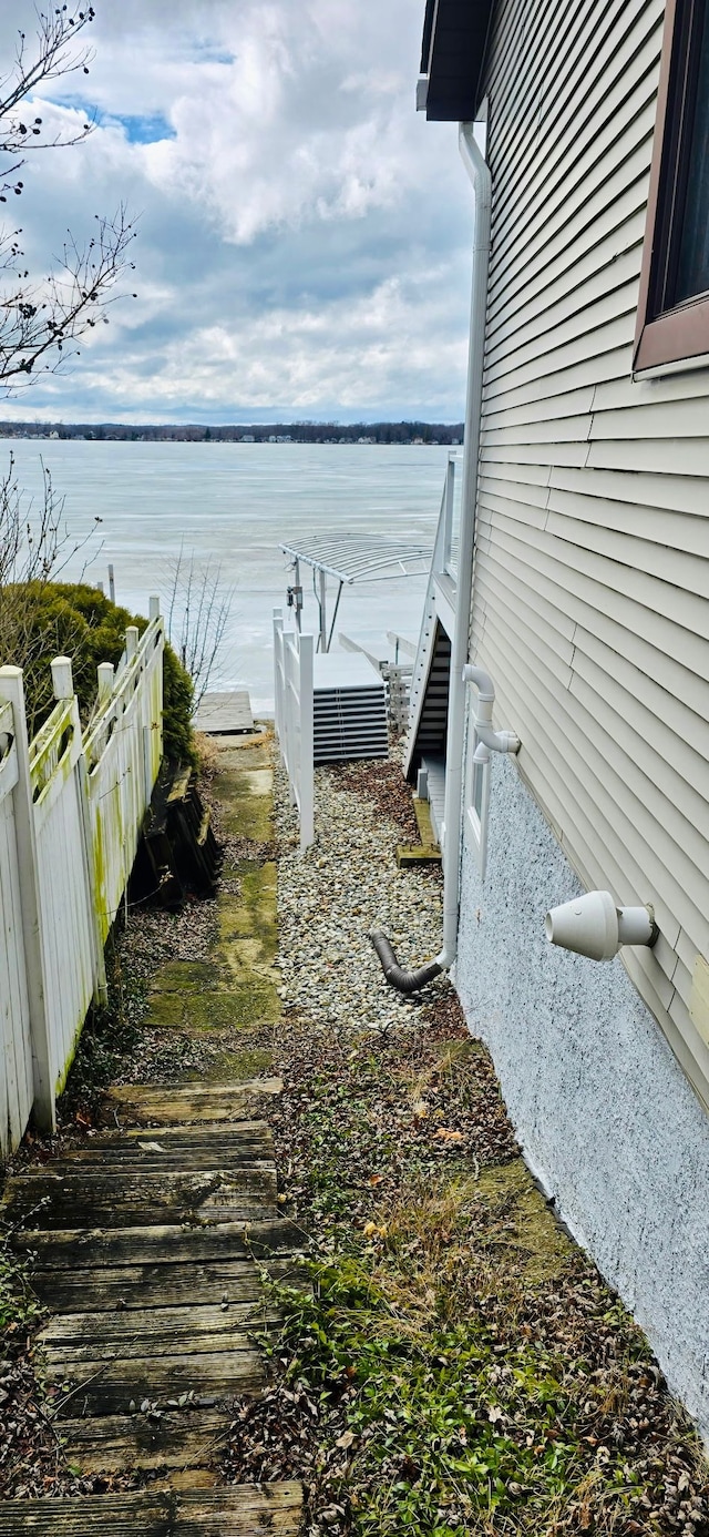 9545 Mcgregor Rd, Pinckney, MI 48169 - view of yard featuring a water view and fence