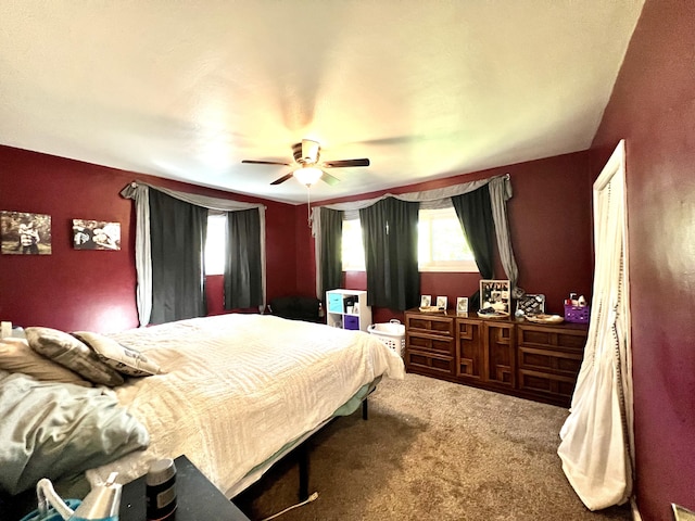 carpeted bedroom featuring a ceiling fan