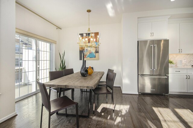 2822 Purley Ave, Ann Arbor, MI 48105 - dining space with a notable chandelier, dark wood-style floors, and baseboards