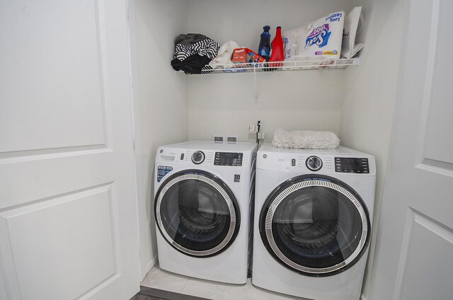 2822 Purley Ave, Ann Arbor, MI 48105 - clothes washing area with tile patterned floors, laundry area, and washing machine and clothes dryer