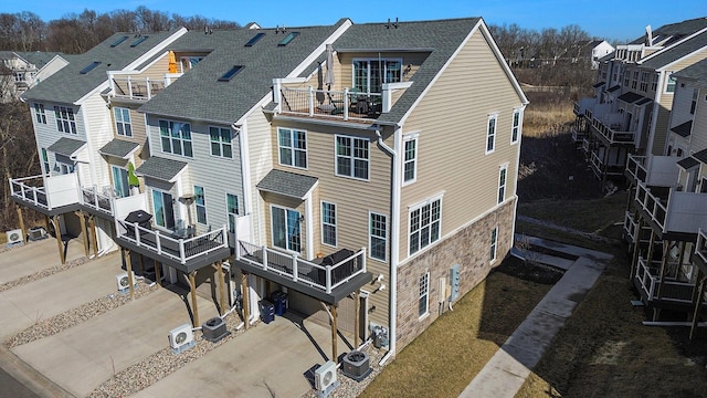2822 Purley Ave, Ann Arbor, MI 48105 - exterior space with concrete driveway, a residential view, and central AC