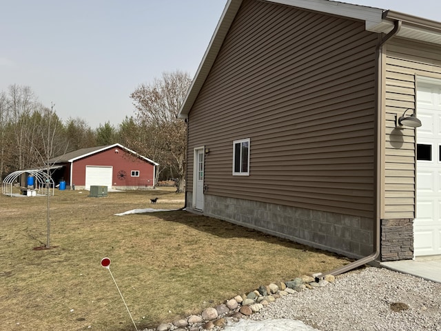 view of side of property with an outdoor structure and central AC unit