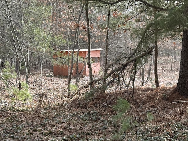 view of landscape with a forest view